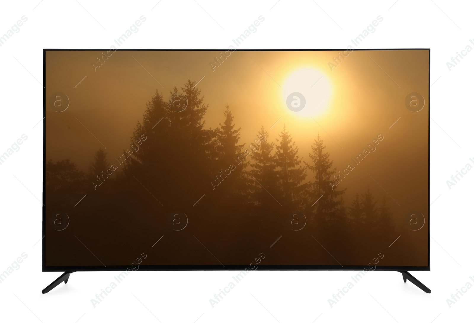 Image of Modern wide screen TV monitor showing foggy forest at sunrise isolated on white