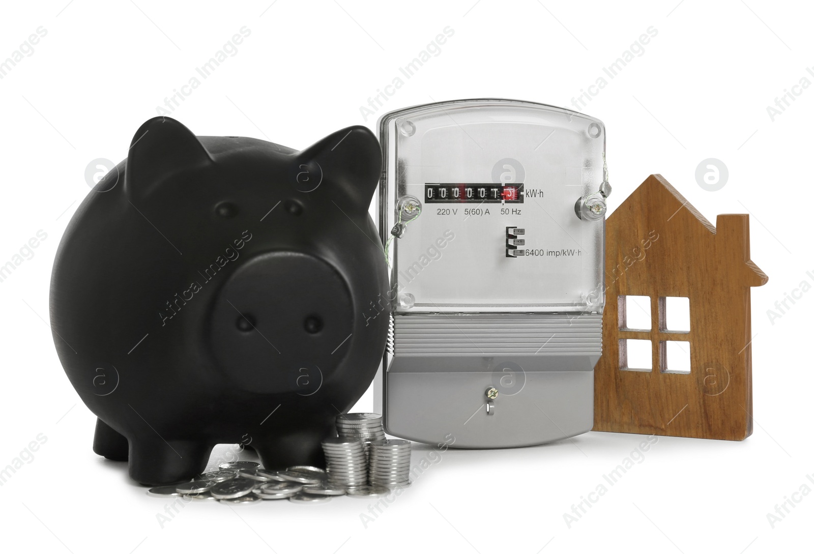 Photo of Electricity meter, house model, piggy bank and coins on white background
