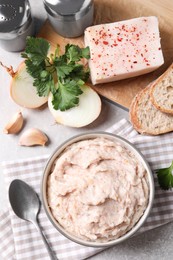Delicious lard spread in bowl on table, flat lay