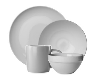 Set of beautiful ceramic dinnerware on white background