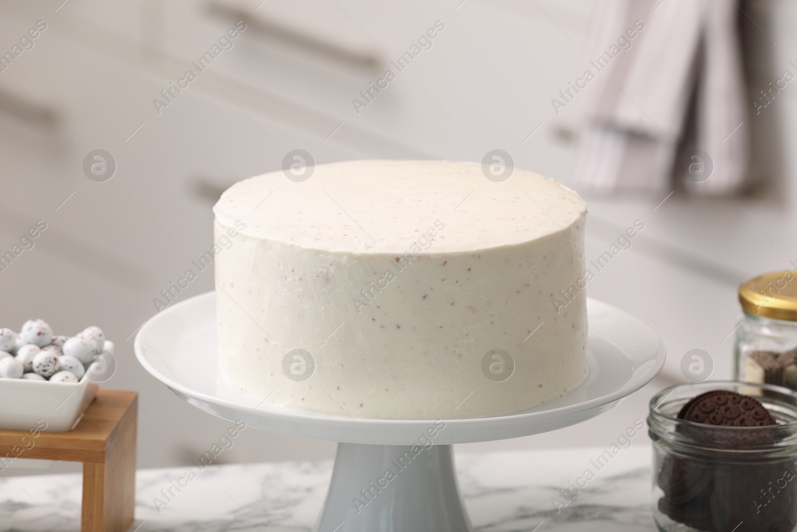 Photo of Delicious cake and sweets for decoration on table indoors