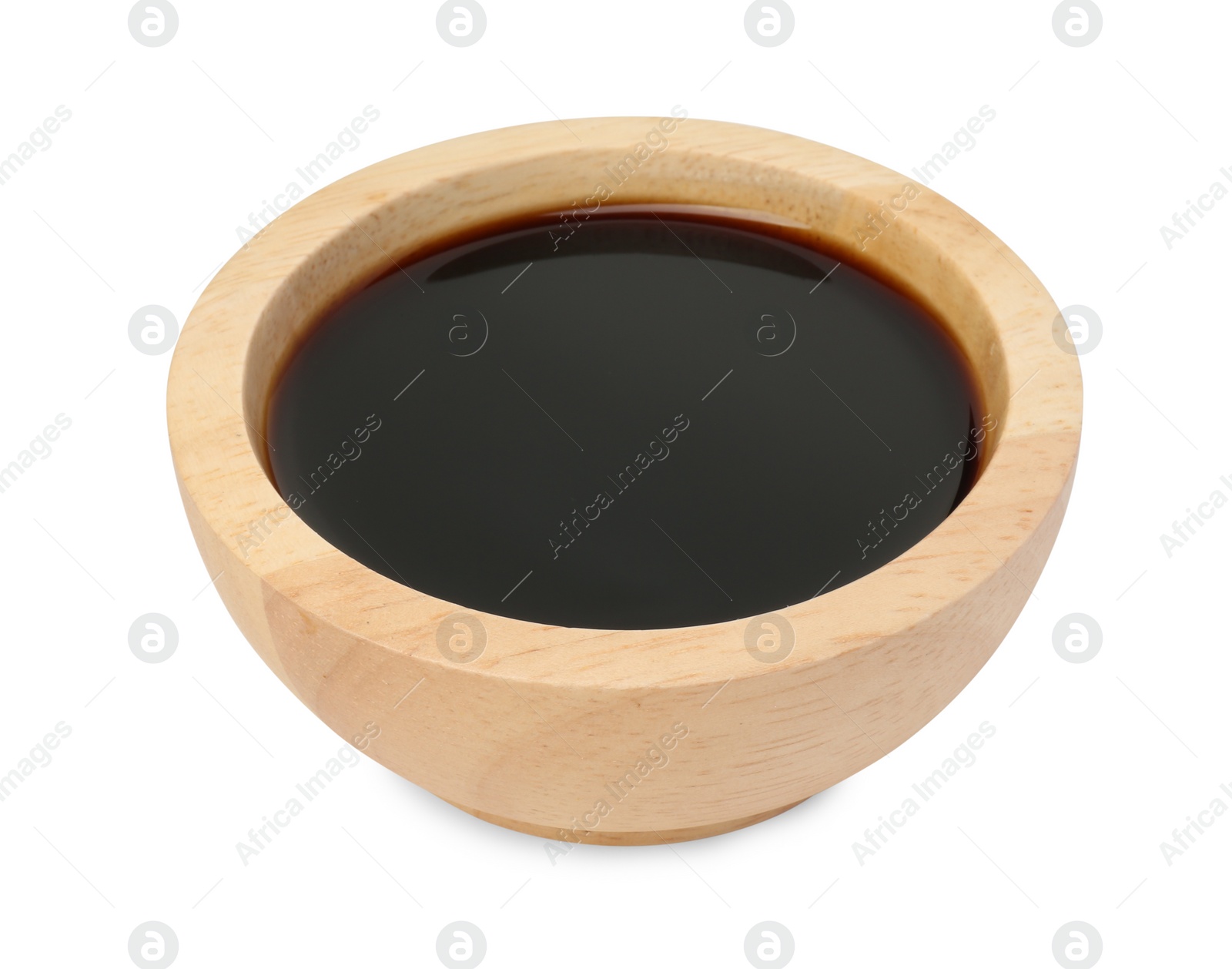 Photo of Tasty soy sauce in wooden bowl isolated on white