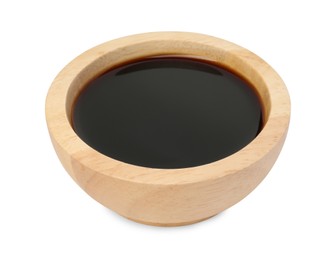 Photo of Tasty soy sauce in wooden bowl isolated on white