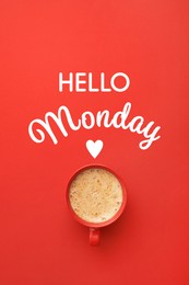 Image of Cup of hot aromatic coffee and phrase Hello Monday on red background, top view