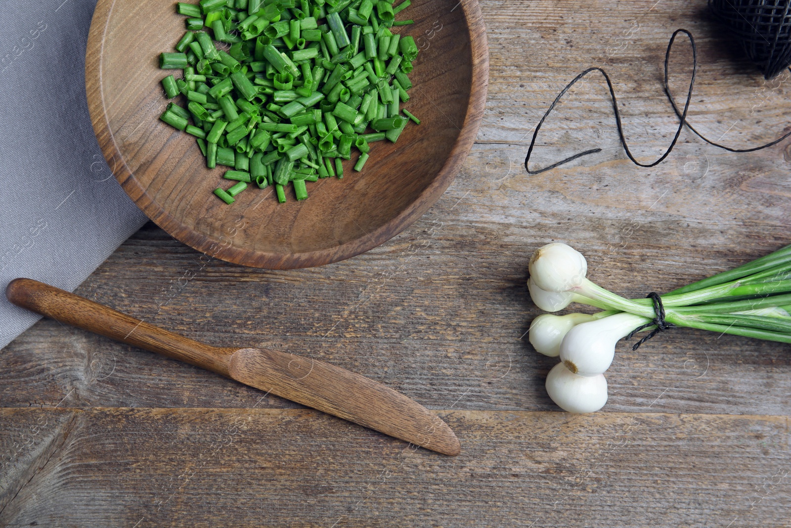 Photo of Beautiful composition with fresh green onion on table, top view