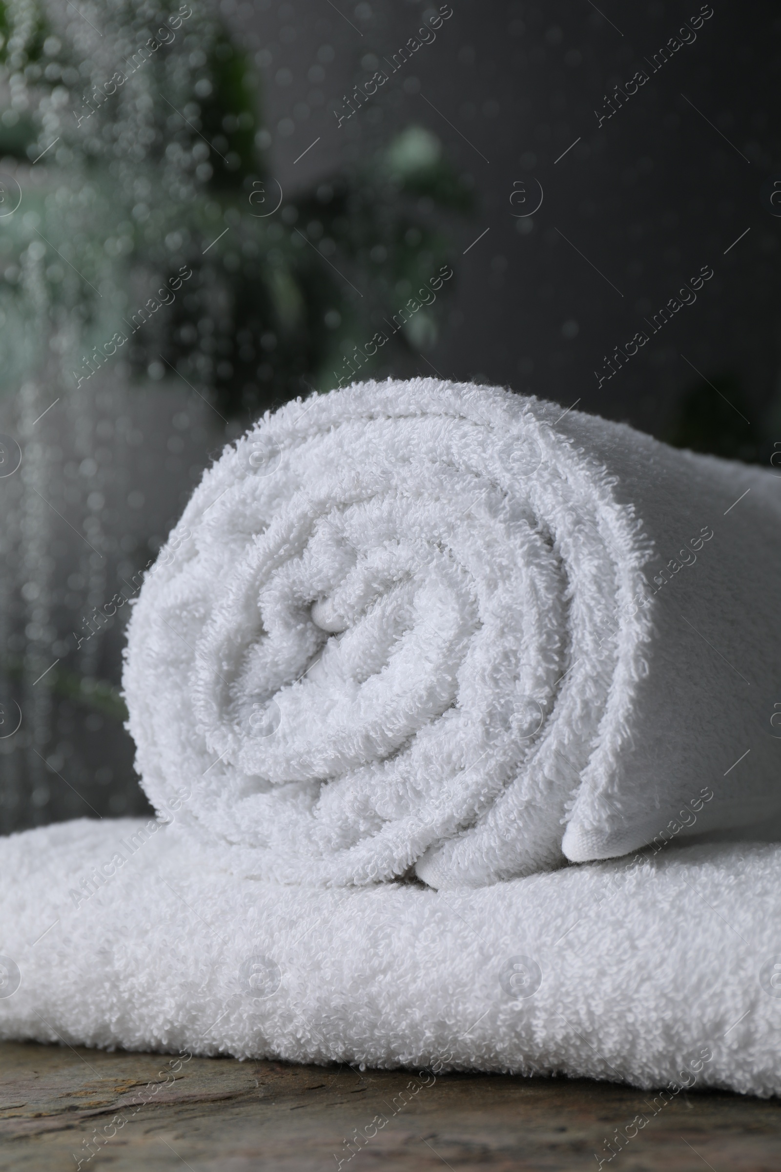 Photo of White terry towels on table in bathroom