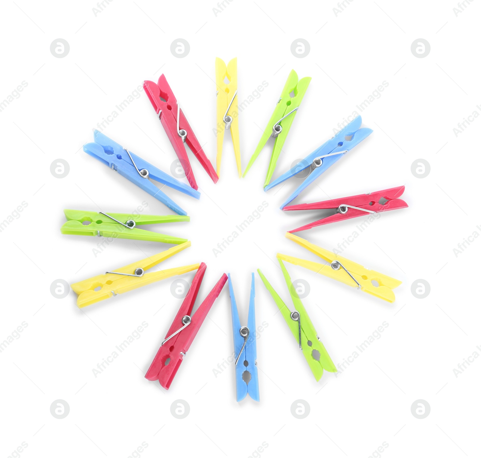 Photo of Colorful plastic clothespins on white background, above view