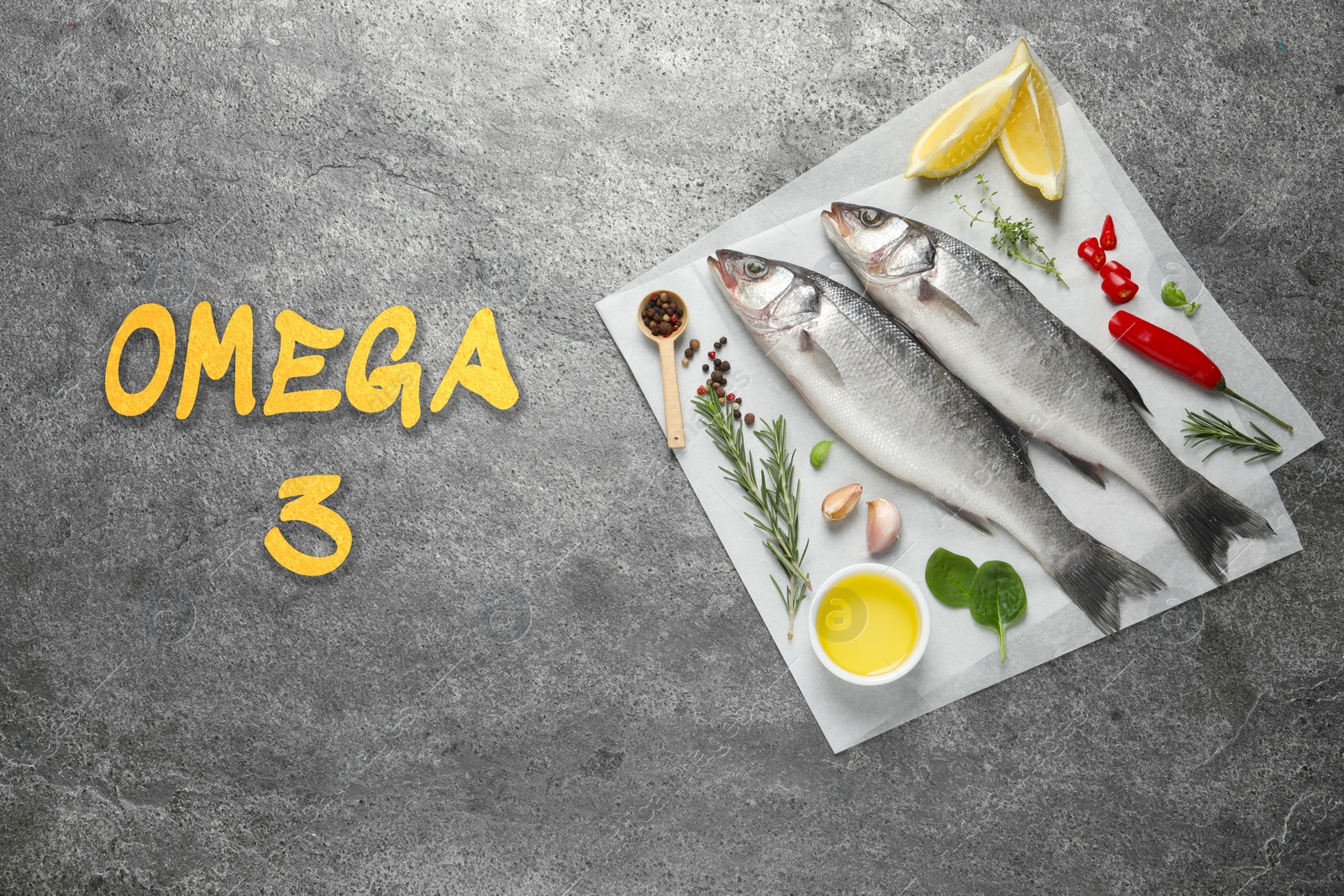 Image of Omega 3. Fresh fish, herbs and spices on grey table, top view