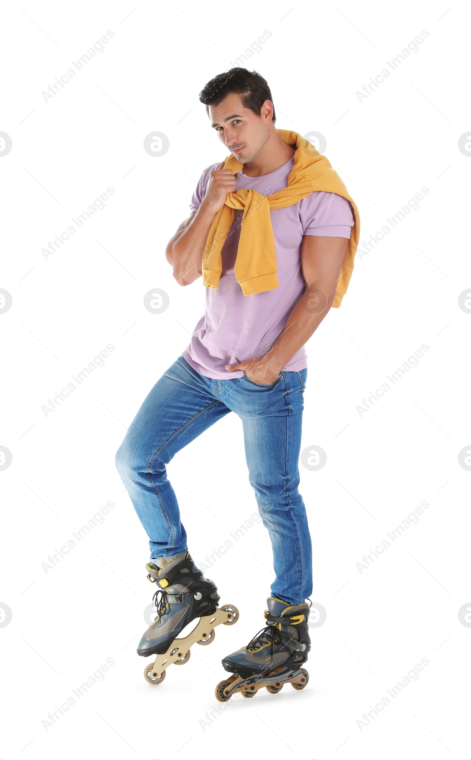 Photo of Handsome young man with inline roller skates on white background