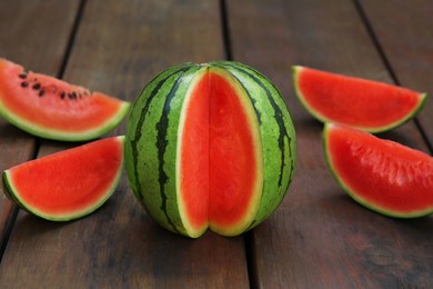 Delicious cut ripe watermelons on wooden table