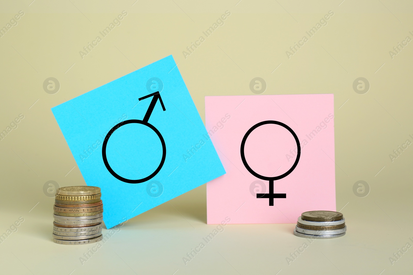 Photo of Gender pay gap. Male and female symbols near piles of coins on beige background