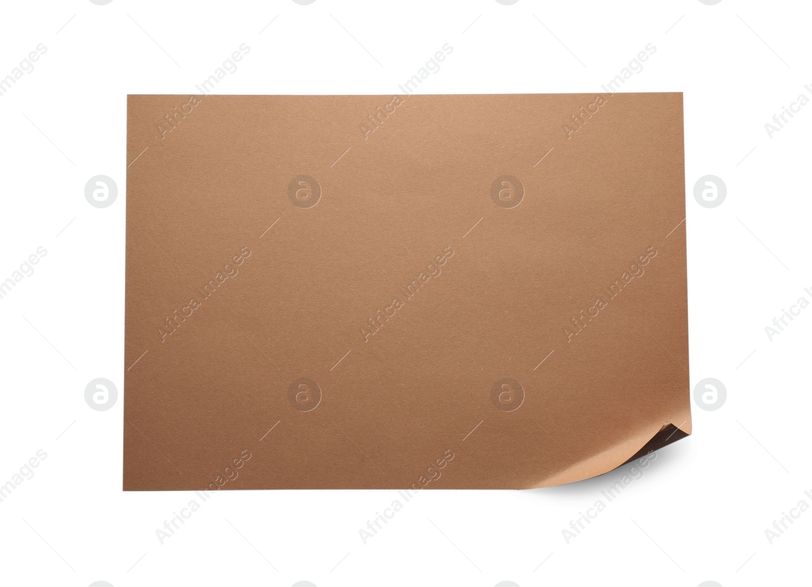 Photo of Empty kraft paper sheet with curved corner isolated on white, top view