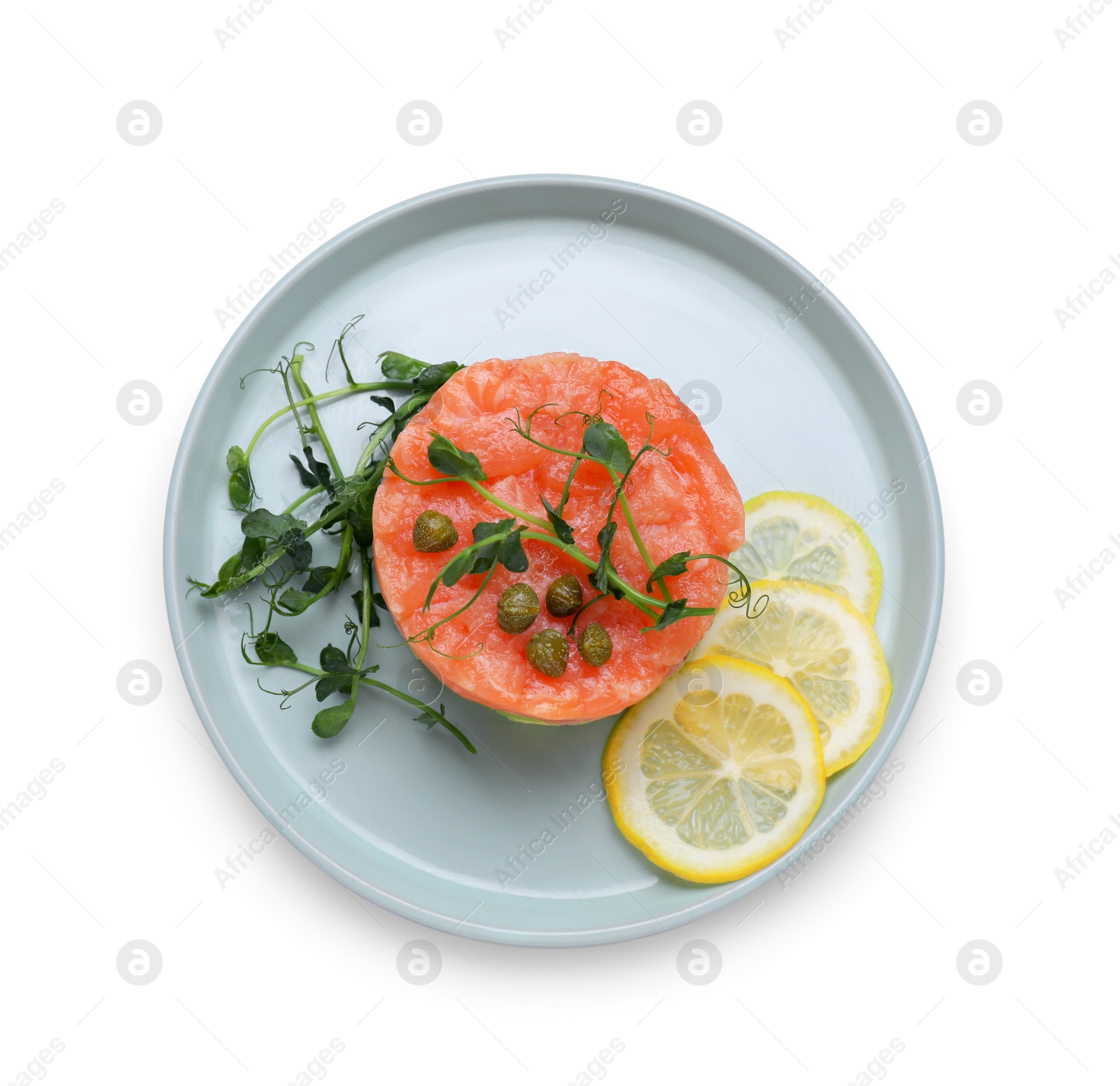 Photo of Tasty salmon tartare with lemon, capers and microgreens isolated on white, top view