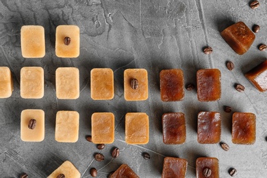 Flat lay composition with coffee ice cubes on grey background