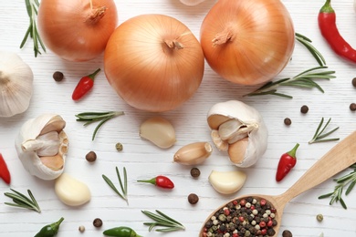 Photo of Composition with garlic, peppers and onions on white wooden background, flat lay