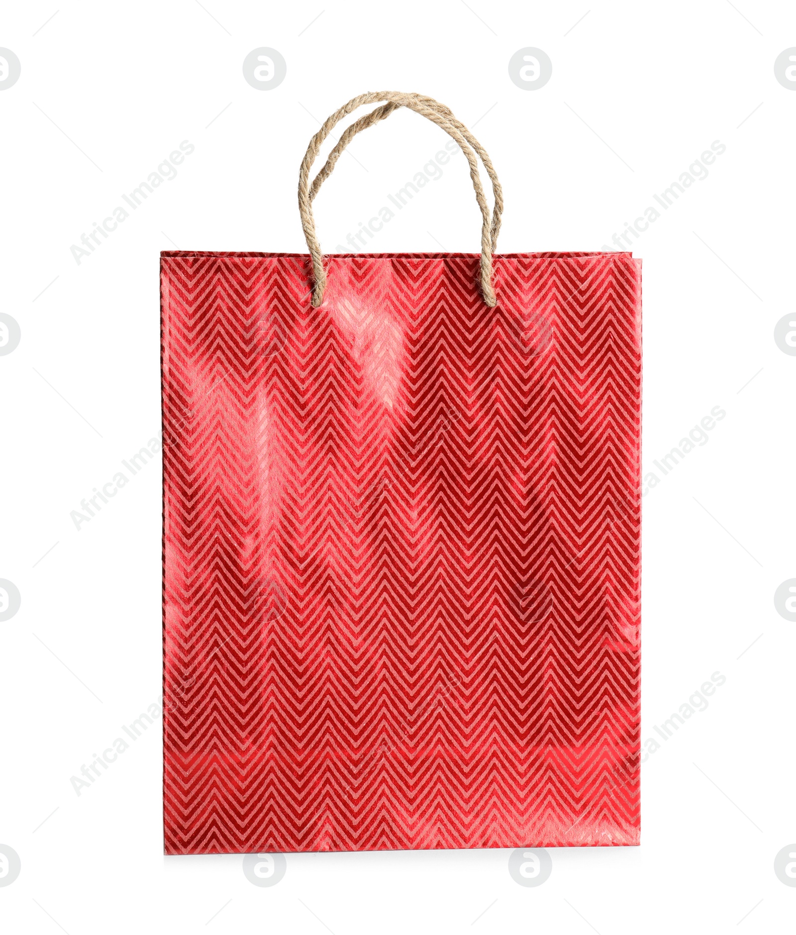 Photo of Red paper shopping bag isolated on white. Space for design