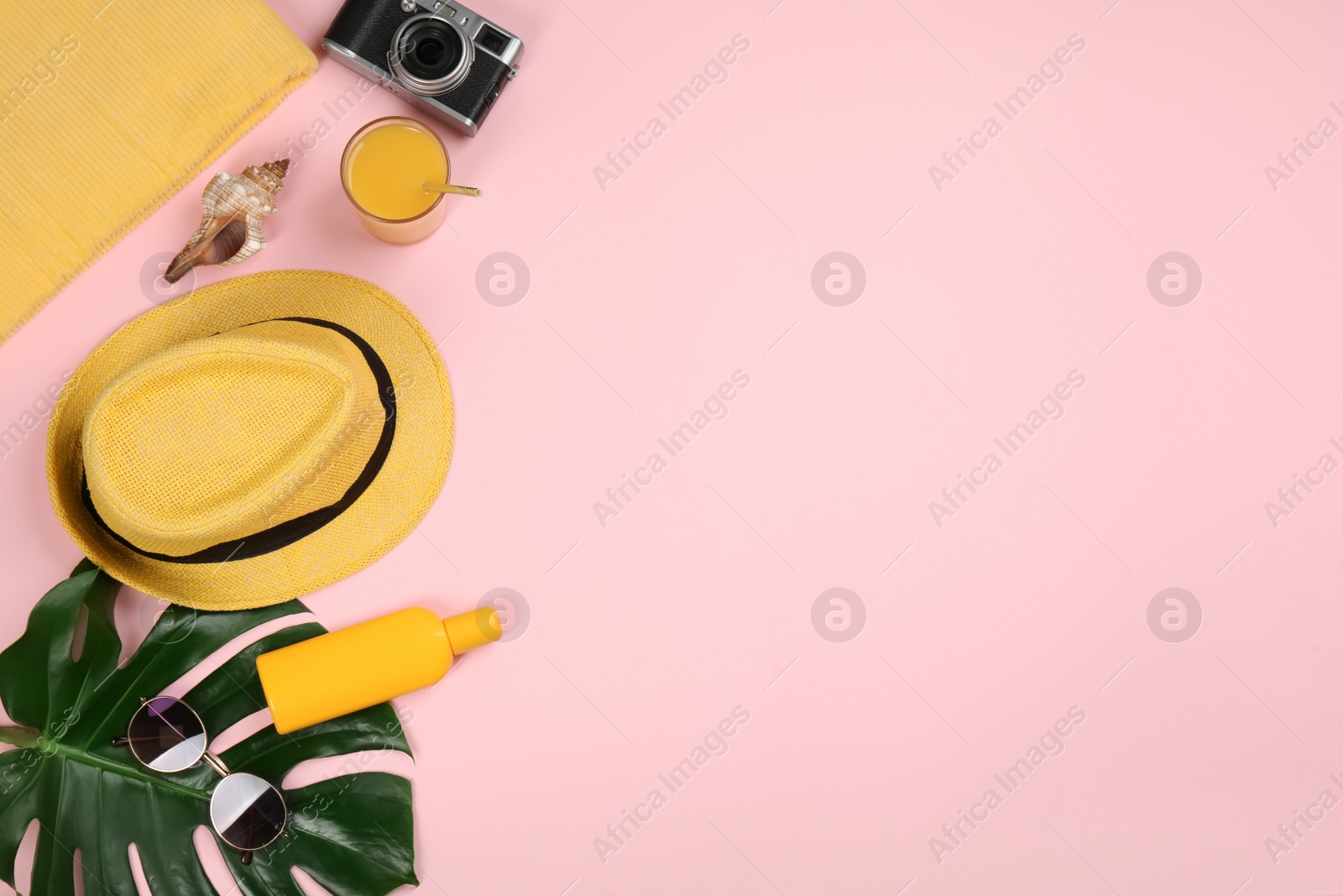 Photo of Flat lay composition with beach objects on pink background, space for text