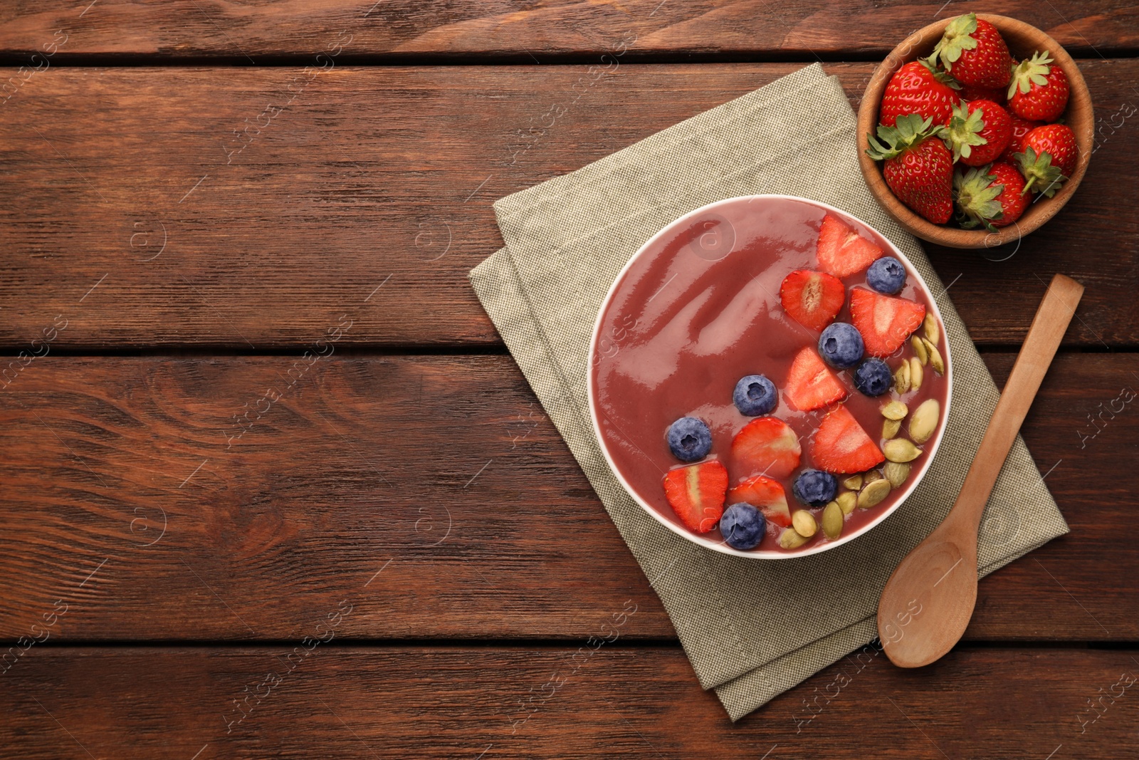 Photo of Flat lay composition with delicious smoothie and ingredients on wooden table. Space for text