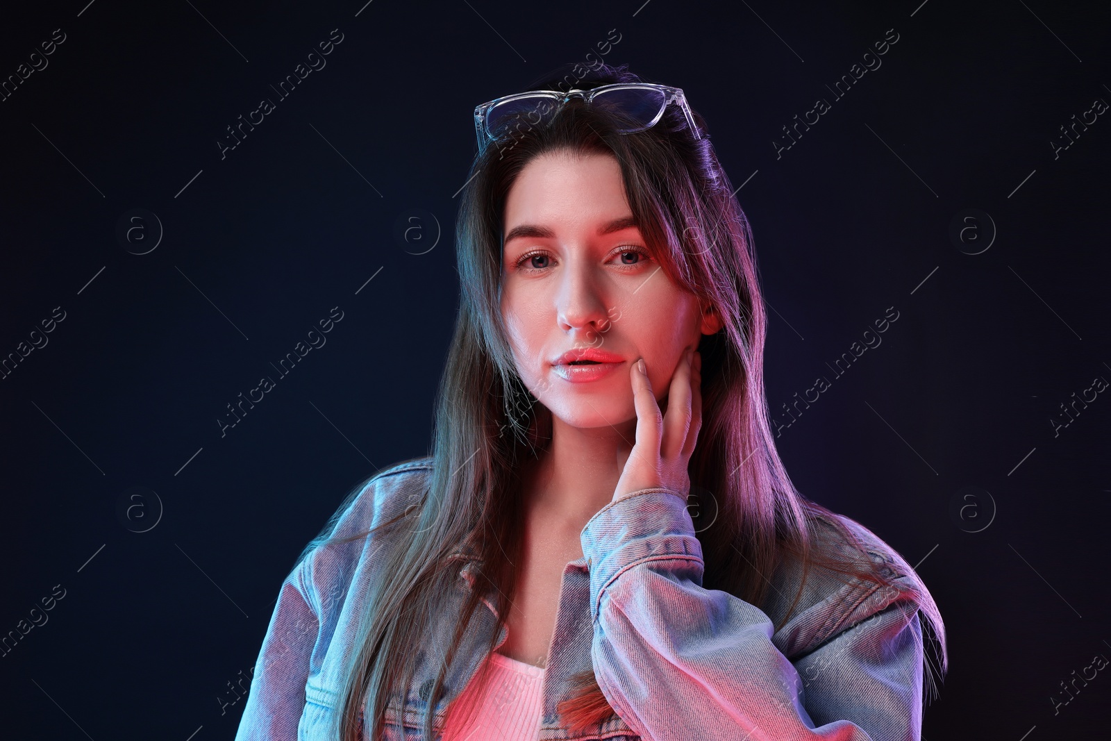 Photo of Portrait of beautiful young woman on color background