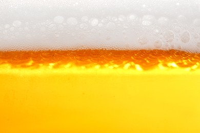 Photo of Tasty beer with foam as background, closeup