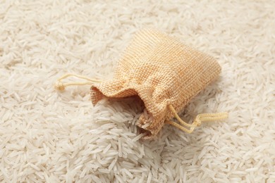 Raw basmati rice and sack, closeup view