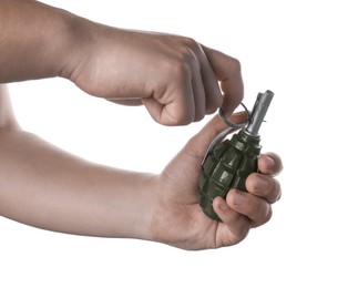 Photo of Man pulling safety pin out of hand grenade on white background, closeup