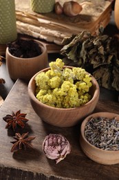 Many different dry herbs, flowers and anise stars on table