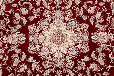 Photo of Soft carpet with beautiful pattern as background, top view