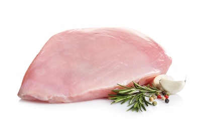 Photo of Raw turkey breast and ingredients on white background