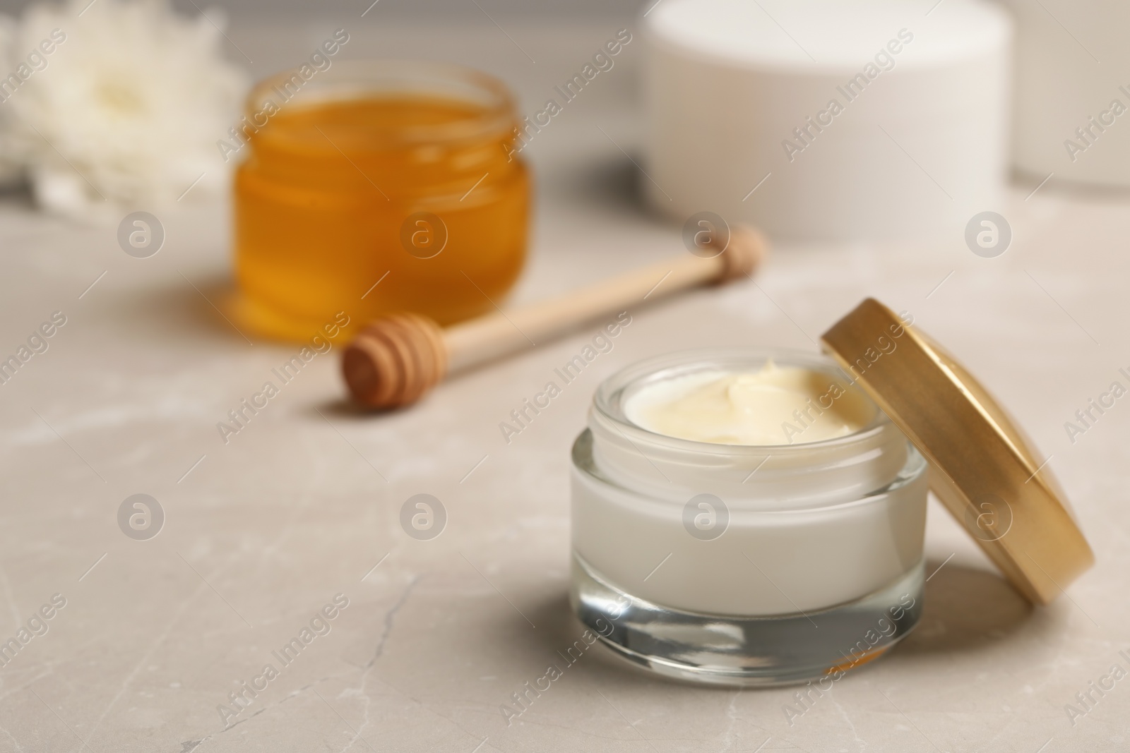 Photo of Hand cream jar on gray background. Natural cosmetic