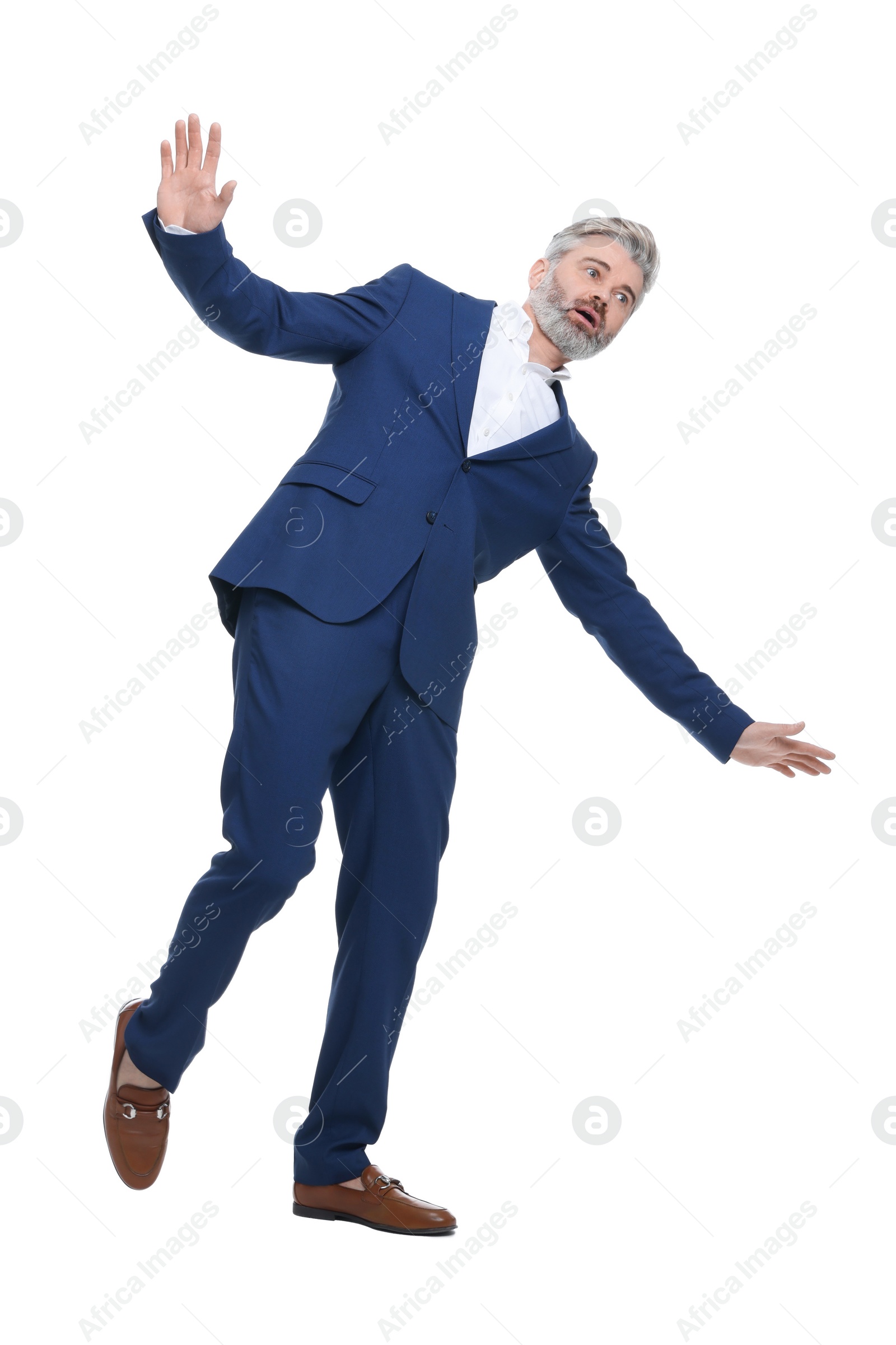 Photo of Mature businessman in stylish clothes posing on white background