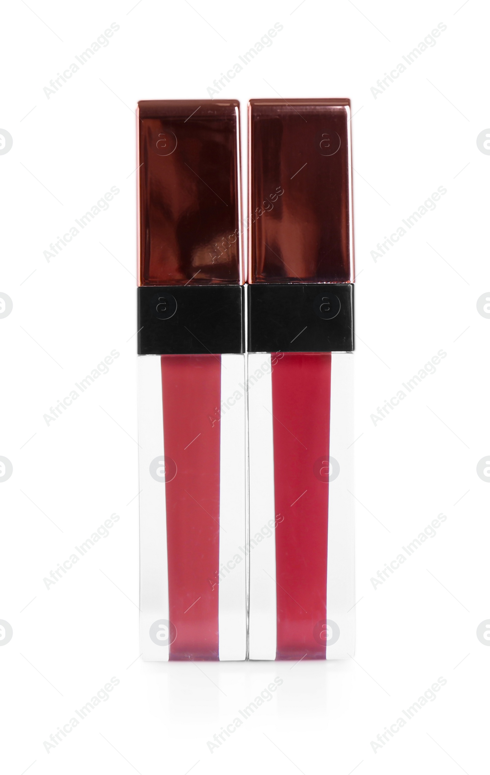 Photo of Two lip glosses isolated on white. Cosmetic products