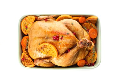 Photo of Roasted chicken with oranges and carrot isolated on white, top view