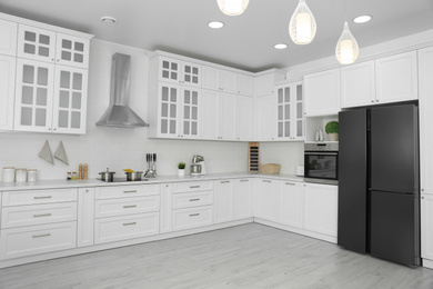 Photo of Beautiful kitchen interior with new stylish furniture