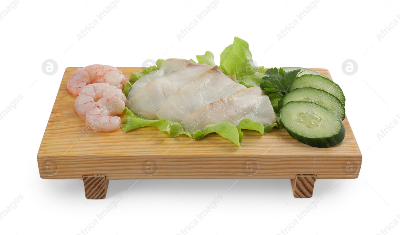 Photo of Sashimi set (raw slices of oily fish and shrimps) served with cucumber, lettuce and parsley isolated on white