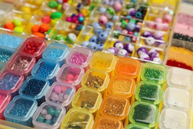 Photo of Organizers with variety of colorful beads as background