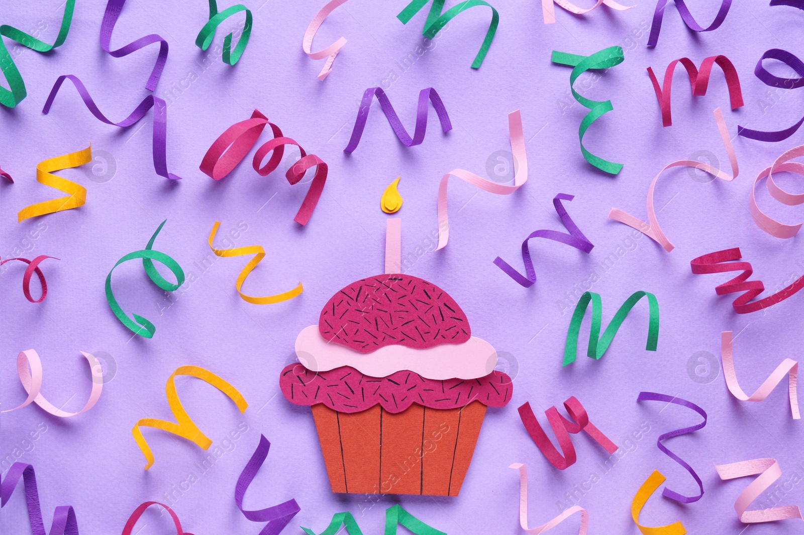 Photo of Birthday party. Paper cupcake and confetti on lilac background, flat lay