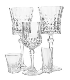 Photo of Different elegant empty glasses isolated on white