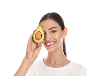 Photo of Happy young woman with avocado on white background. Organic face mask