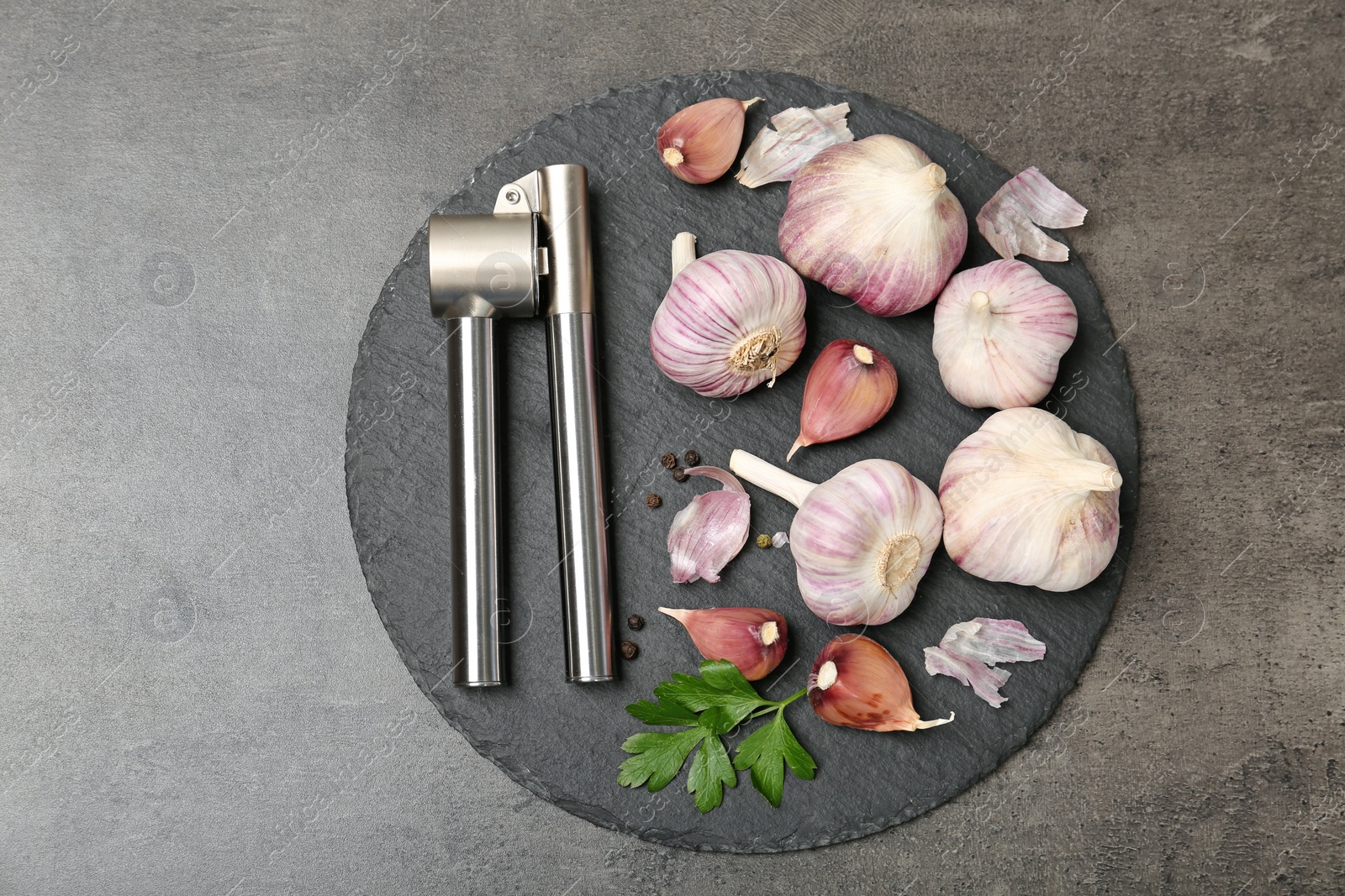 Photo of Flat lay composition with garlic press on table