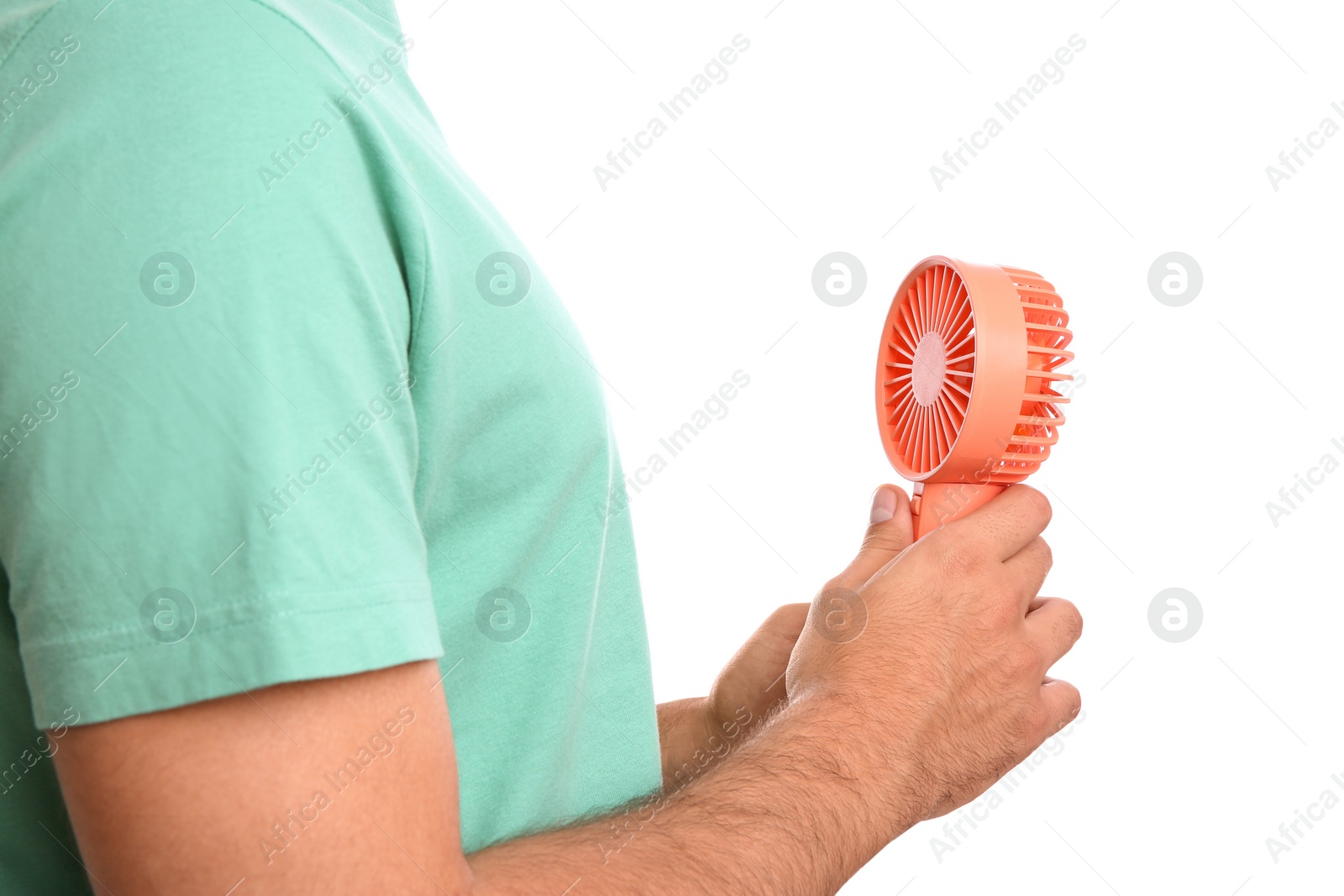 Photo of Man with portable fan on white background, closeup. Summer heat