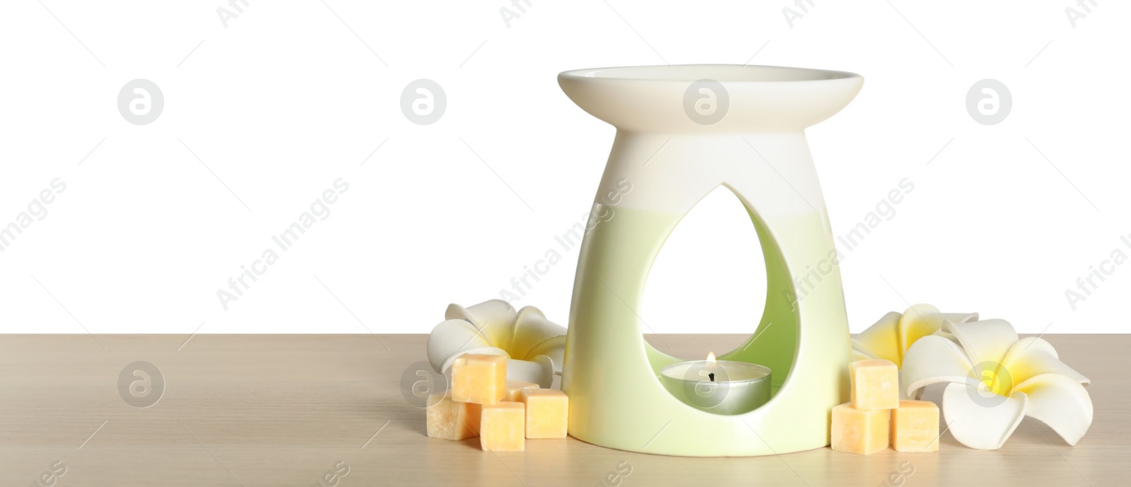 Photo of Composition with aroma lamp on wooden table against light grey background, space for text