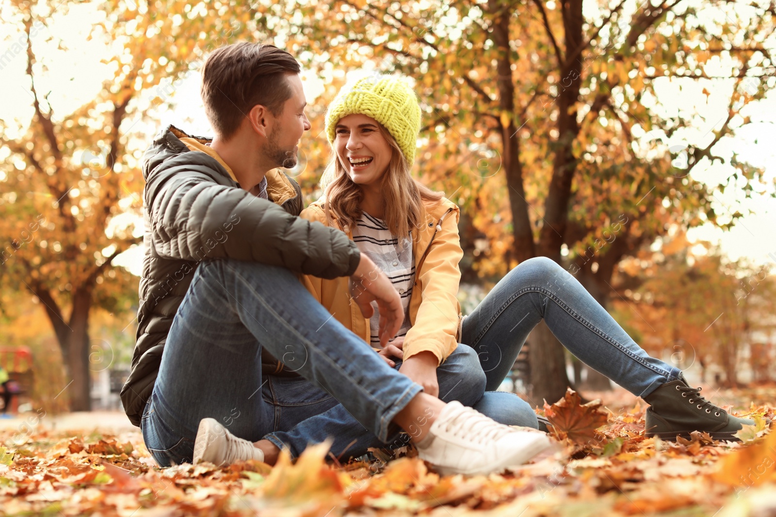 Photo of Lovely couple spending time together in park. Autumn walk