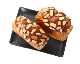 Photo of Round croissants with chocolate paste and nuts isolated on white, top view. Tasty puff pastry