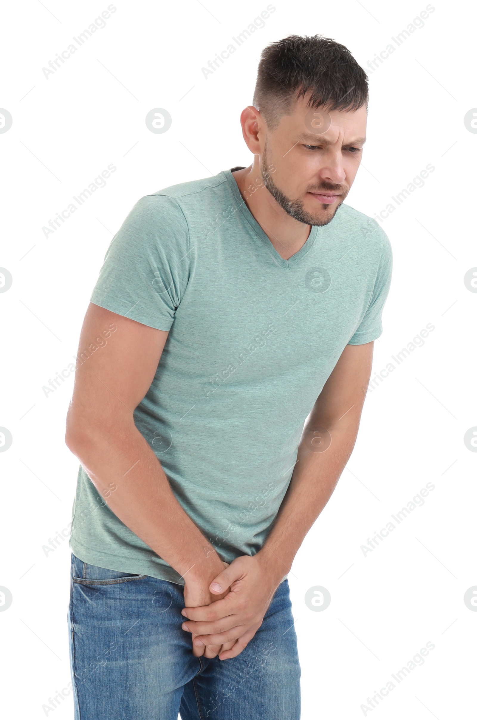Photo of Man suffering from pain on white background. Urology problems