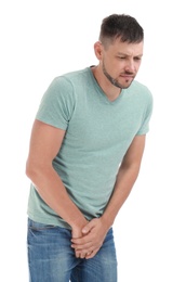 Photo of Man suffering from pain on white background. Urology problems