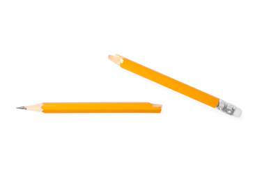 Photo of Broken graphite pencil on white background, top view