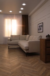 Photo of Modern living room with parquet flooring and stylish furniture