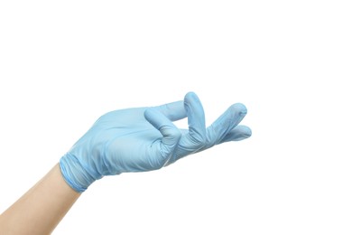 Photo of Doctor wearing light blue medical glove holding something on white background, closeup