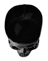 Photo of Black glossy skull isolated on white, top view